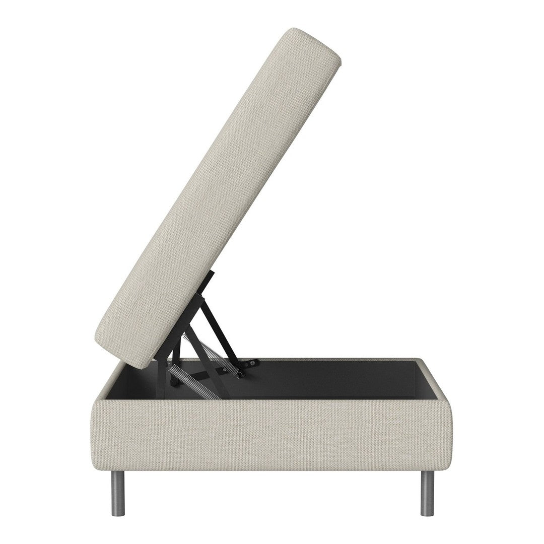 Light beige upholstered storage ottoman with modern gray legs and minimalist design.