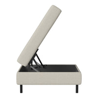 Beige upholstered storage ottoman with a minimalist design and sleek black legs, featuring a simple, textured fabric pattern.