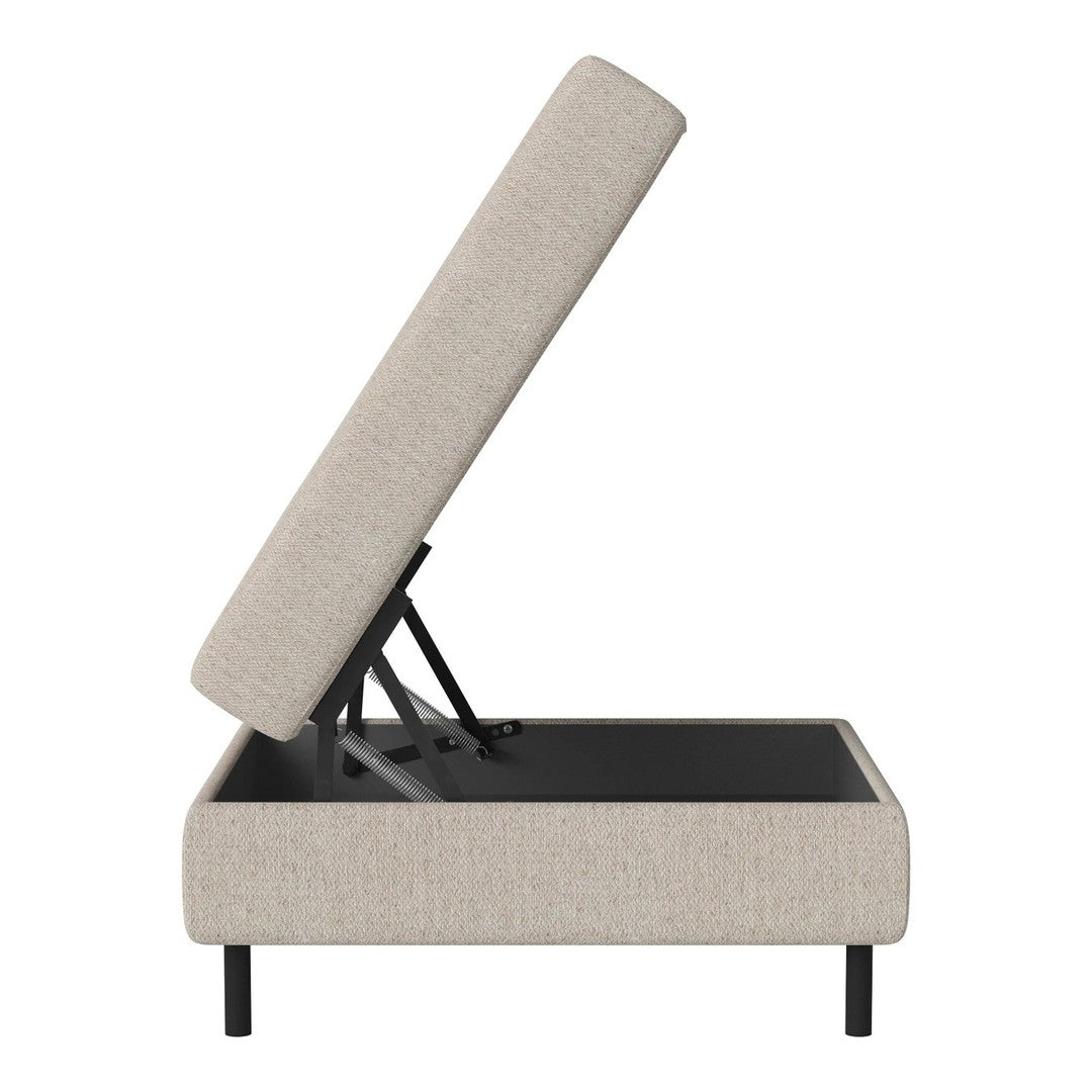 Beige upholstered storage ottoman with a sleek black base and modern design, showcasing a minimalist style.