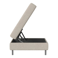 Light beige upholstered storage ottoman with sleek minimalist design and metal legs, featuring a solid black interior.