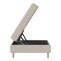 Beige fabric storage ottoman with light wooden legs, featuring a smooth, modern design and subtle texture.