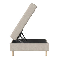 Beige upholstered storage ottoman with natural wooden legs and a minimalist design for modern interiors.