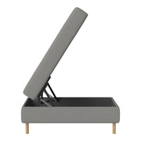 Gray upholstered storage bed with a minimalist design and natural wood legs. Clean lines and modern aesthetic.