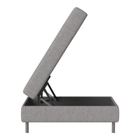 Gray upholstered ottoman with a sleek, modern design and a minimalist pattern. Features a lifting top for storage.