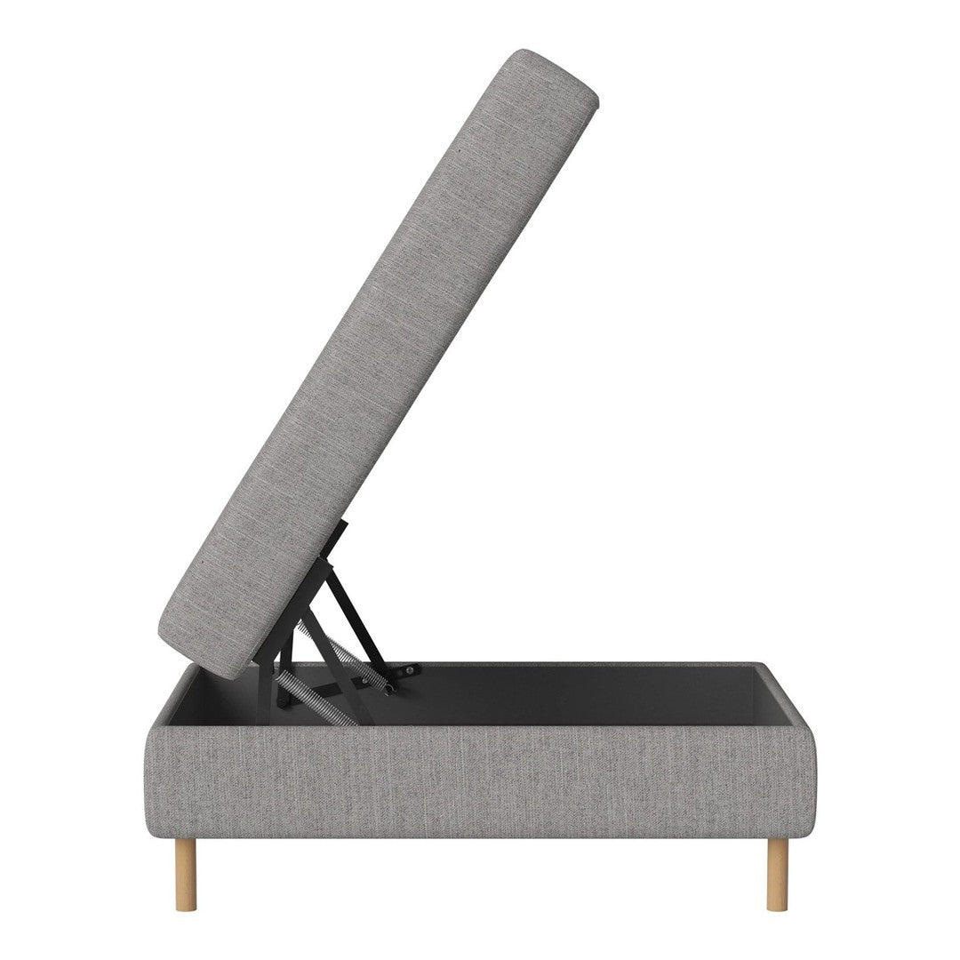 Gray upholstered lift-top storage ottoman with a minimalist design and natural wood legs. Soft texture and sleek lines.