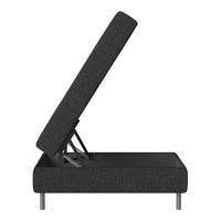 Black upholstered storage bed with a textured fabric and sleek metal legs, showcasing a modern, minimalist design.