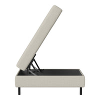 Beige upholstered storage bed with sleek black metal frame and clean lines, perfect for modern decor.