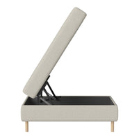 Light gray storage bed with a textured fabric surface and natural wood legs, showcasing a minimalist design.