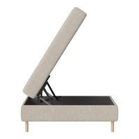 Light beige upholstered storage bed with natural wood legs and a clean, modern design.