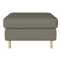 Gray upholstered ottoman with a textured pattern and light wooden legs. Perfect for modern and minimalist decor.