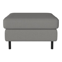 Gray upholstered ottoman with subtle texture and minimalist design, featuring black wooden legs.