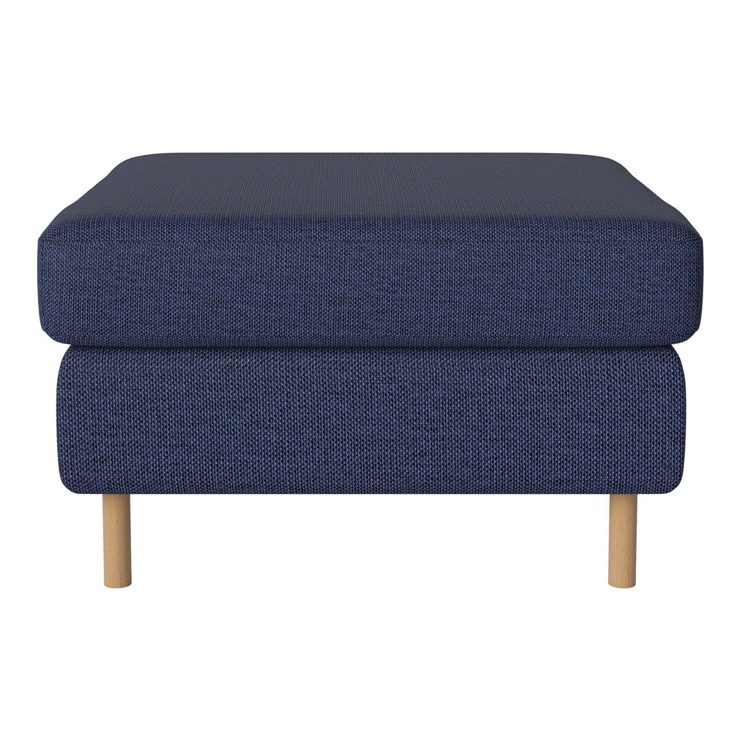 Navy blue upholstered ottoman with a textured pattern and natural wooden legs. Ideal for modern decor.