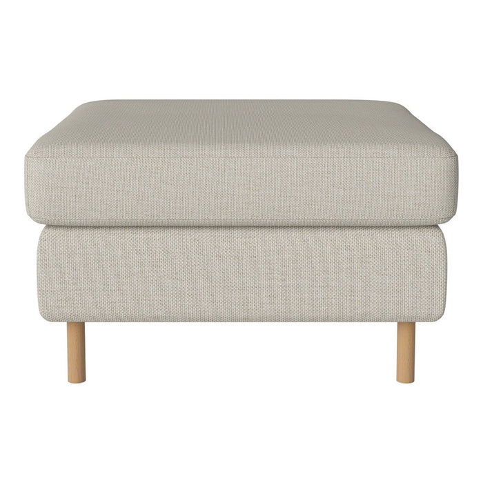 Light beige ottoman with a textured fabric finish and natural wood legs. Versatile and modern design for any space.