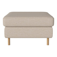 Beige textured ottoman with a clean design and light wooden legs, perfect for versatile home décor.
