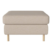 Cream textured ottoman with a minimalist design and light wood legs, perfect for modern living spaces.