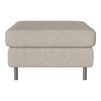 Beige textured ottoman with a minimalist design and sleek metal legs, adding elegance to any space.