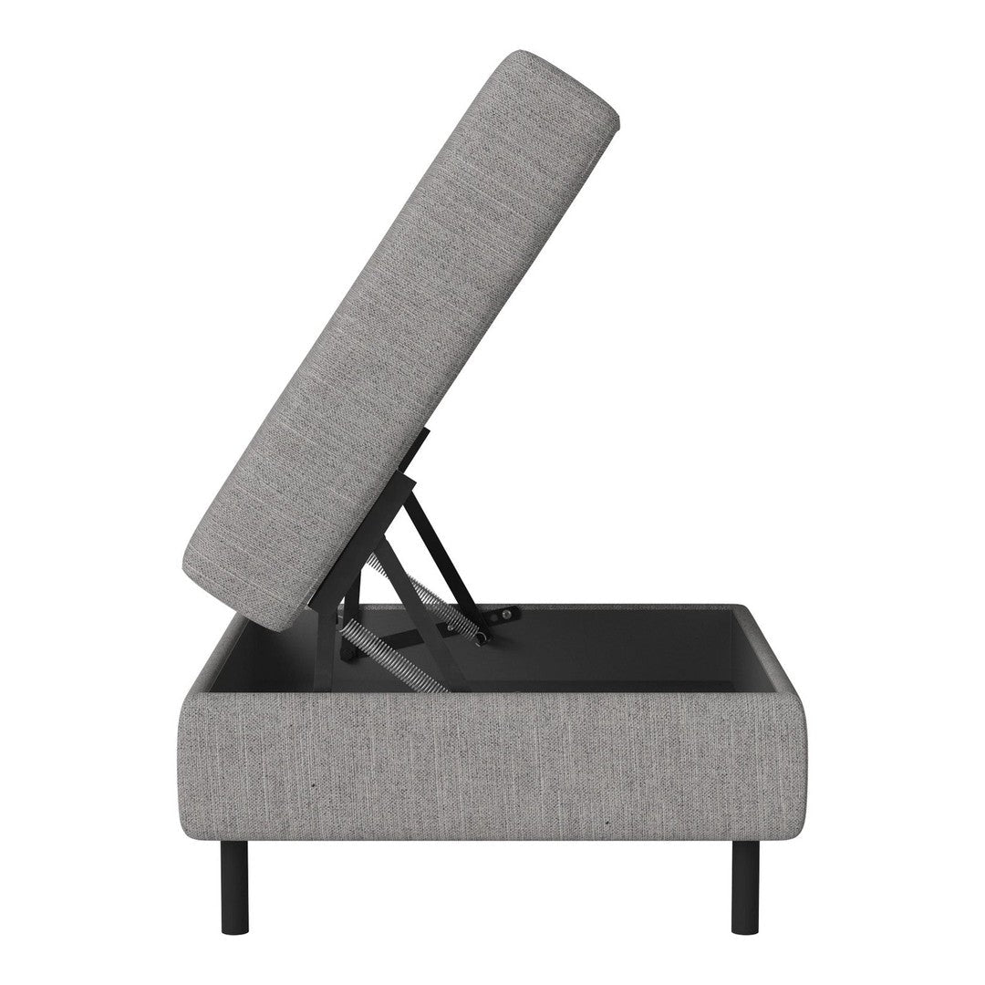 Gray upholstered storage ottoman with a sleek fabric texture and black metal frame.