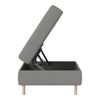 Gray upholstered storage bed with a textured pattern and natural wood legs, showcasing a modern design approach.