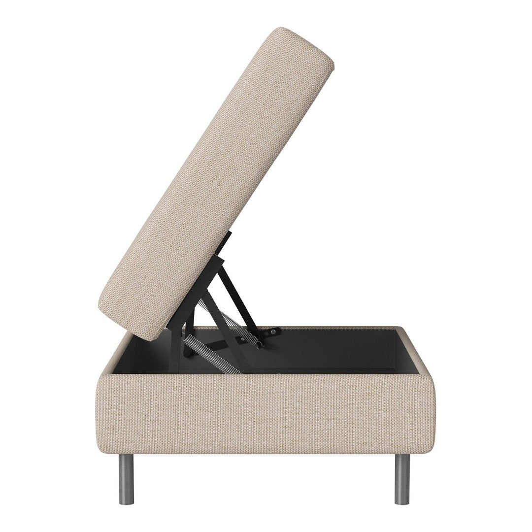 Beige upholstered storage ottoman with a clean, modern design and sleek black base. Stylish and functional accent piece.