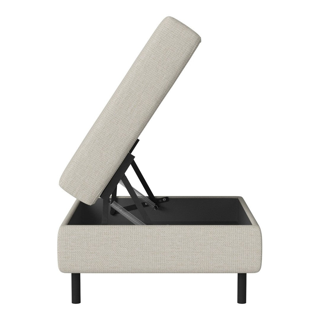Beige upholstered storage ottoman with a sleek black base and minimalist design. Perfect for modern decor.