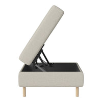 Light gray upholstered storage ottoman with a minimalist design and natural wood legs. Features a clean, modern aesthetic.
