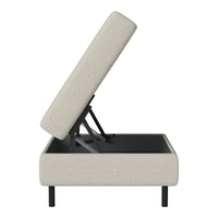 Light beige upholstered storage unit with subtle textured pattern and sleek black legs. Ideal for modern interiors.