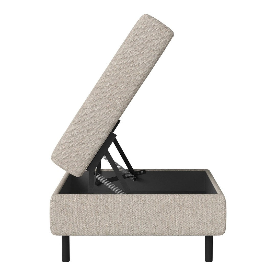 Light beige upholstered ottoman with a textured fabric pattern, featuring black metal legs and a lift-top design.