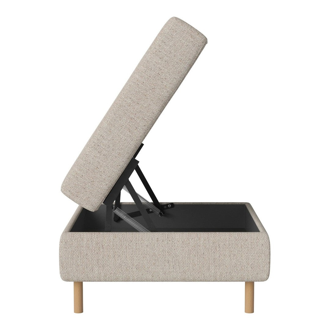 Light beige upholstered storage ottoman with a textured fabric and natural wood legs. Ideal for contemporary decor.
