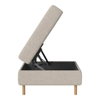Light beige upholstered storage ottoman with a textured fabric and natural wood legs. Ideal for contemporary decor.