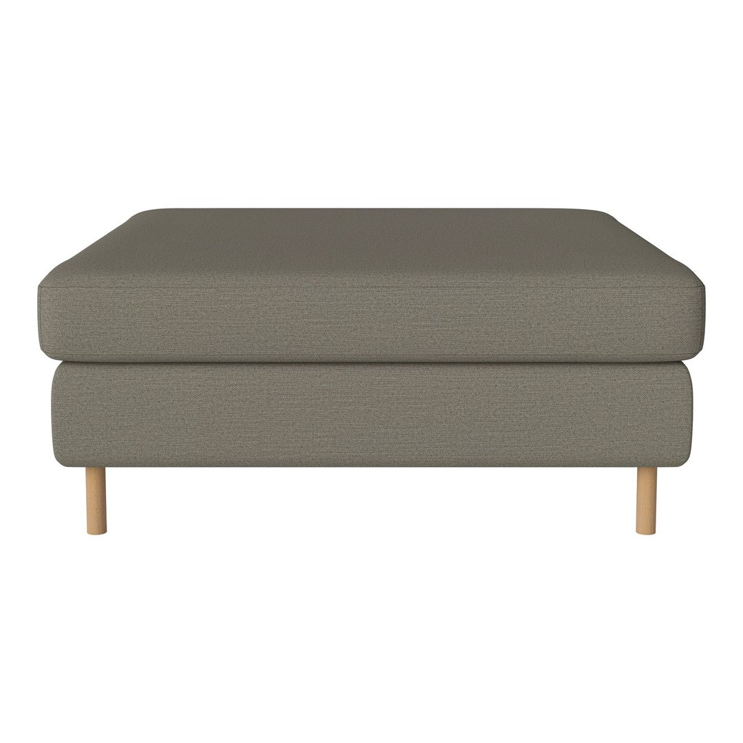 Soft gray upholstered ottoman with clean lines and natural wood legs, perfect for modern decor.
