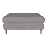 Gray upholstered ottoman with a smooth fabric finish and natural wood legs, perfect for modern decor.
