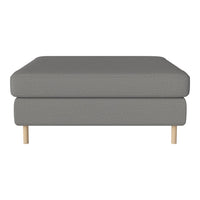Gray upholstered ottoman with a subtle textured pattern and light wooden legs. Ideal for modern decor.