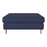 Navy blue upholstered ottoman with a textured pattern and light wood legs for a modern touch.