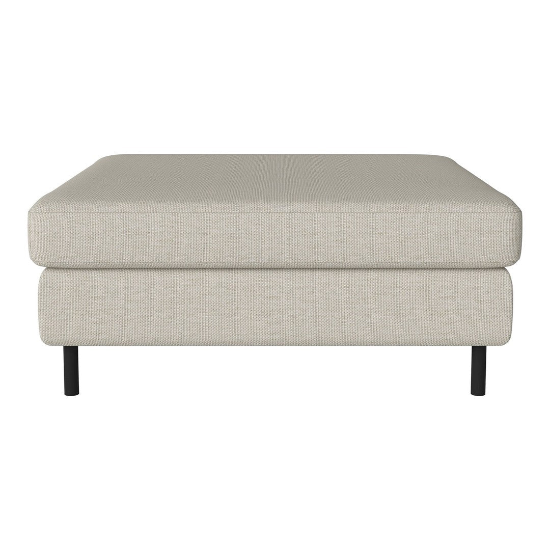 Light beige ottoman with a smooth, textured fabric and sleek black legs. Simple and modern design.