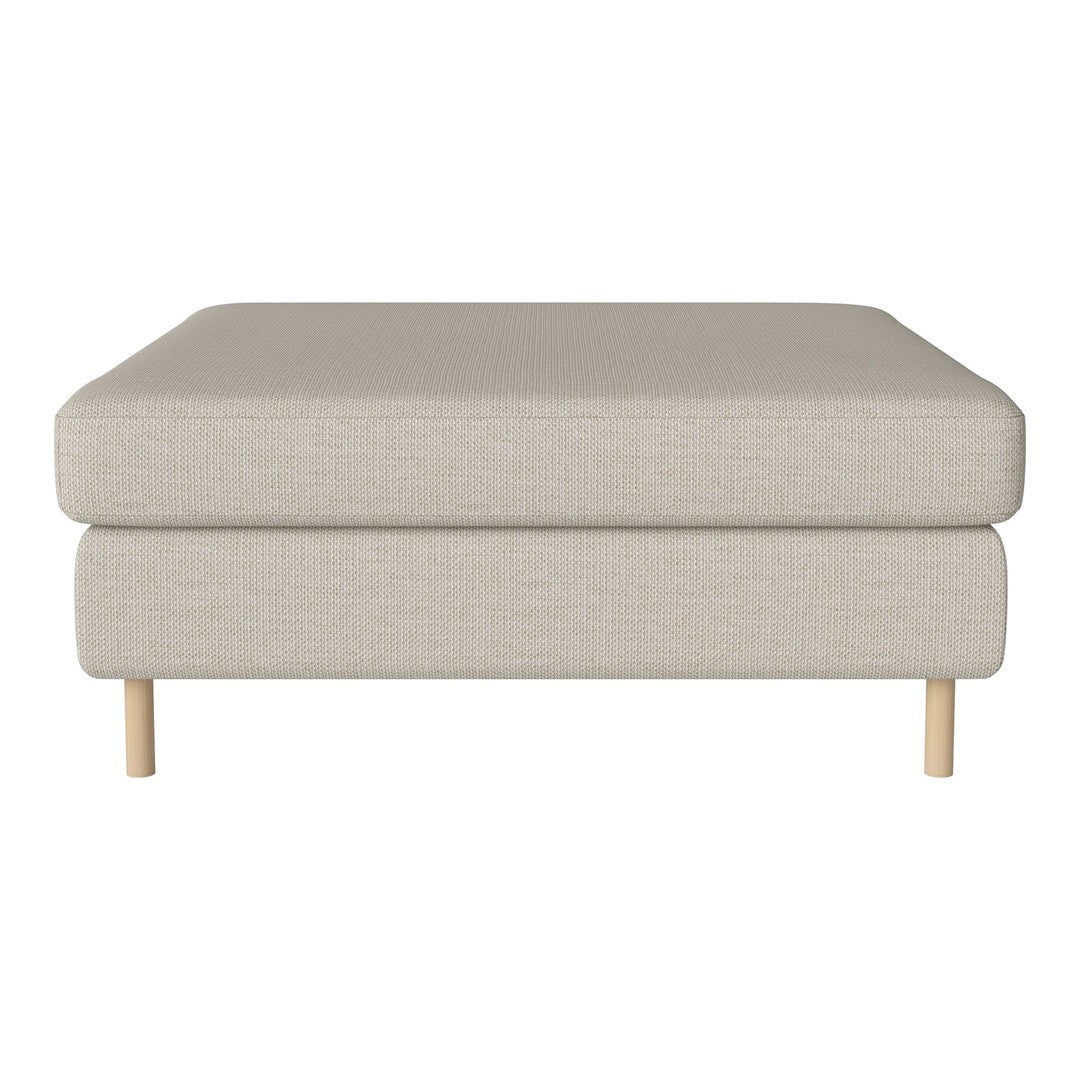 Light beige upholstered ottoman with textured fabric and natural wood legs, showcasing a minimalist design.