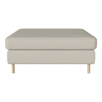 Light beige upholstered ottoman with textured fabric and natural wood legs, showcasing a minimalist design.