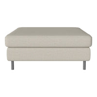 Beige upholstered ottoman with a smooth texture and sleek silver legs, perfect for modern decor.