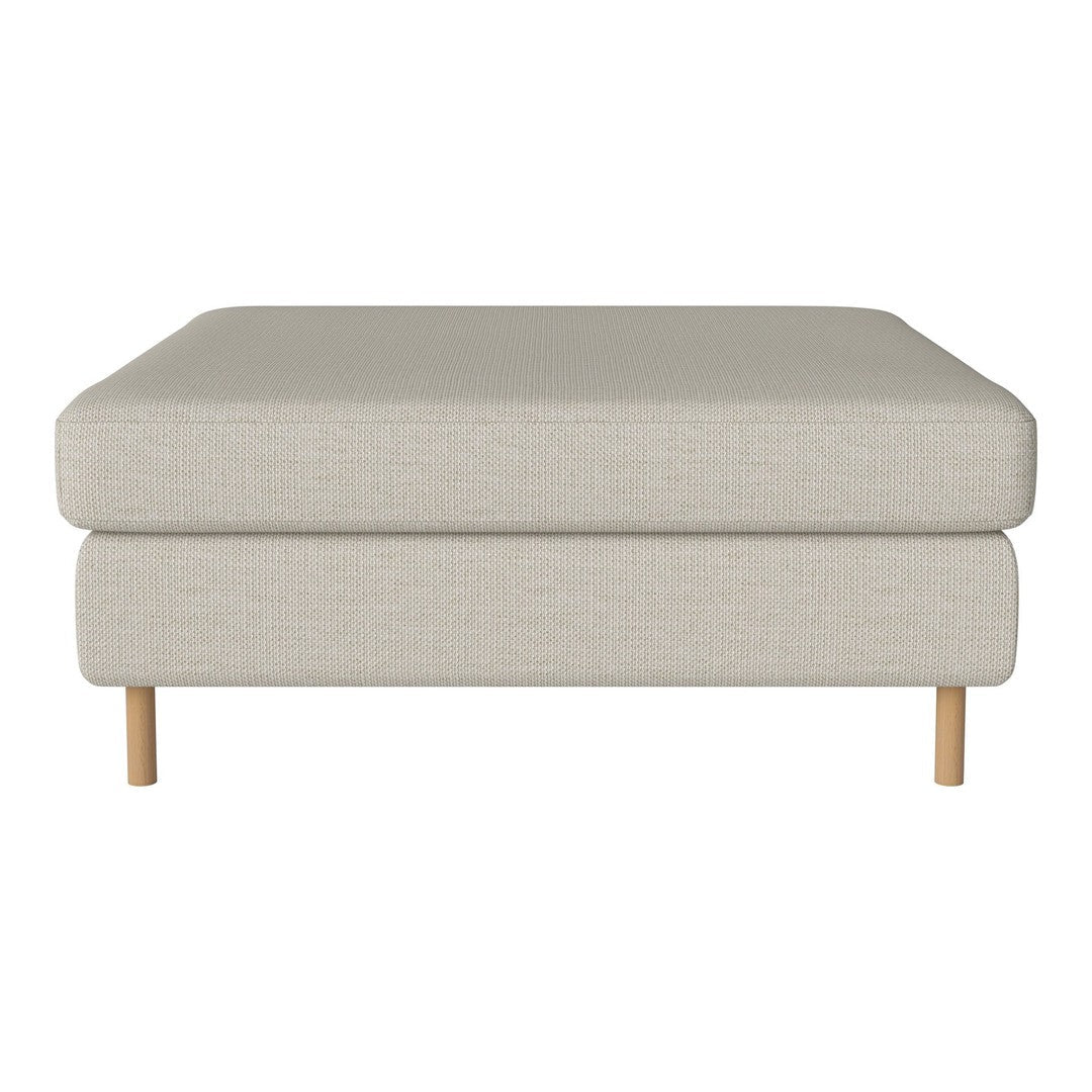 Neutral beige ottoman with a smooth texture and minimalist design, featuring light wood legs. Perfect for modern decor.