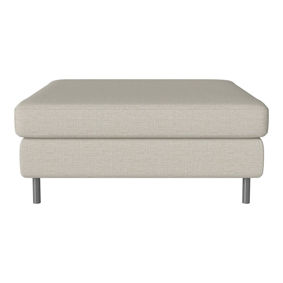 Light beige square ottoman with a smooth fabric texture and sleek metal legs, perfect for modern living spaces.