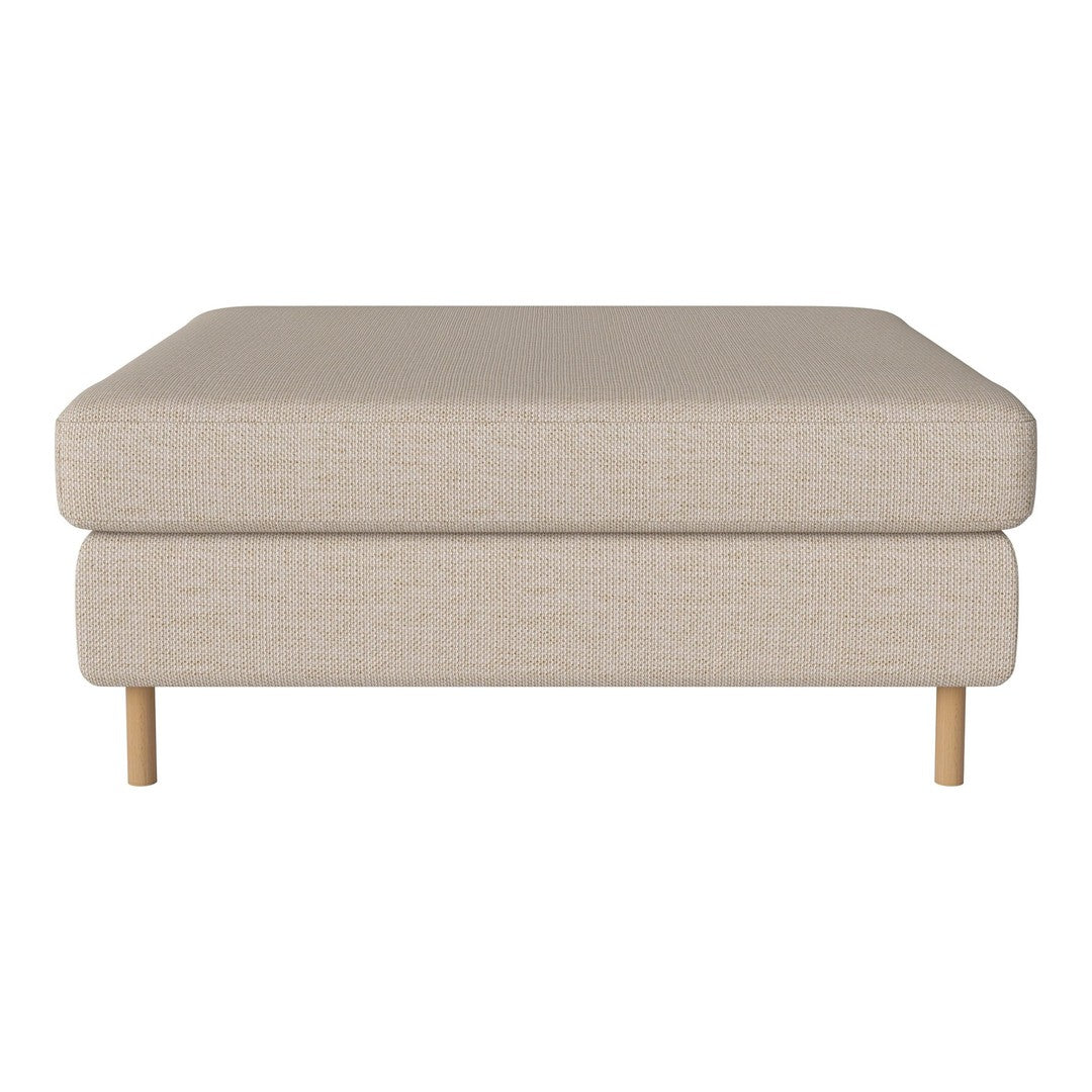 Beige upholstered ottoman with a minimalist design and natural wood legs, perfect for modern interiors.