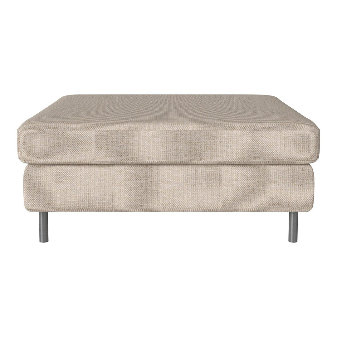 Beige fabric ottoman with simple, clean lines and metal legs, perfect for modern or minimalist decor.
