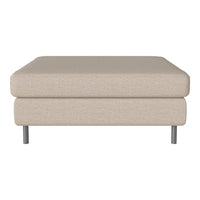 Beige fabric ottoman with simple, clean lines and metal legs, perfect for modern or minimalist decor.