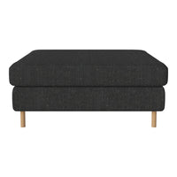 Black upholstered ottoman with a textured finish and natural wood legs. Ideal for modern living spaces.