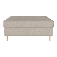 Beige upholstered ottoman with textured fabric and light wood legs, perfect for modern living spaces.