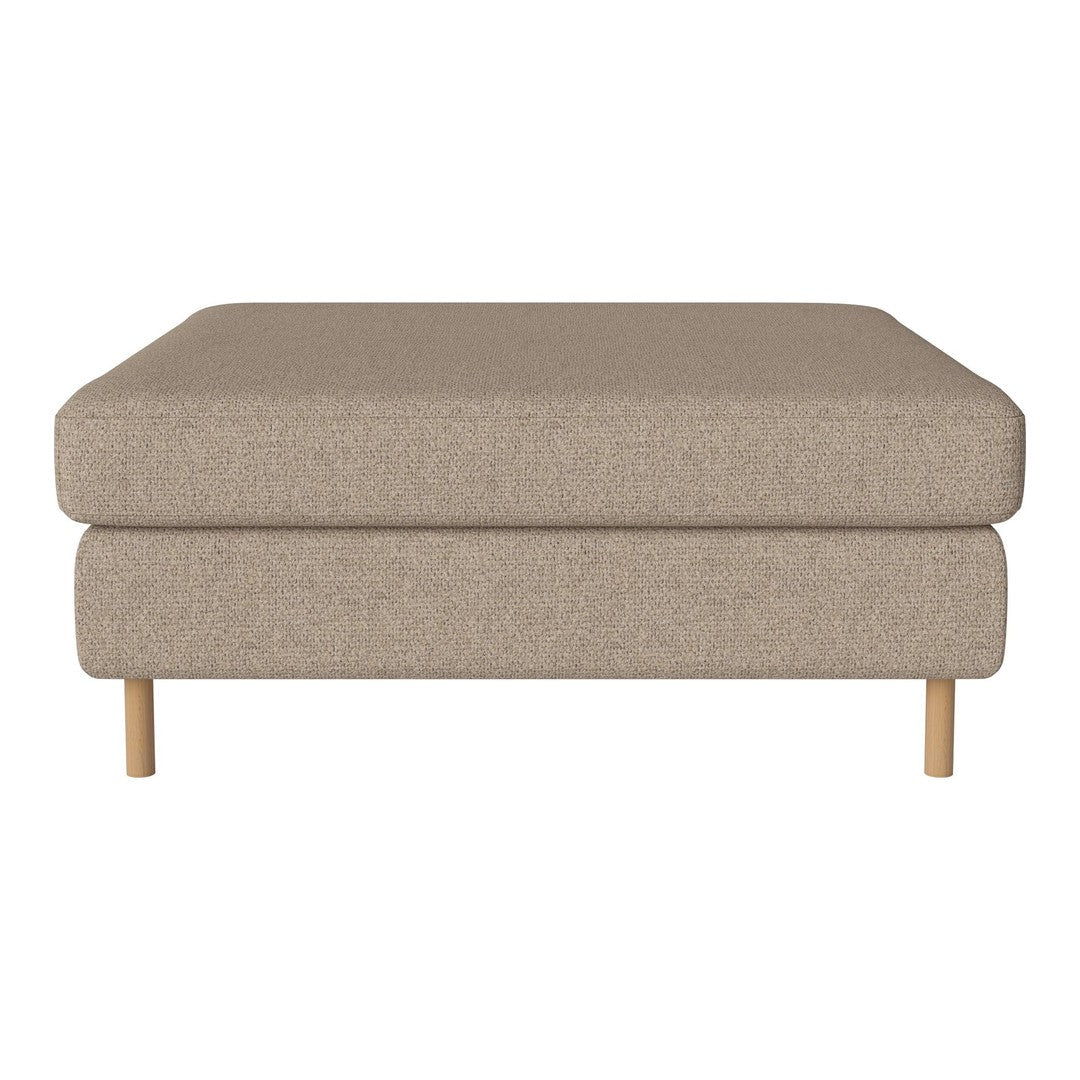 Beige upholstered ottoman with a minimalist design and natural wood legs. Soft, textured surface for modern decor.