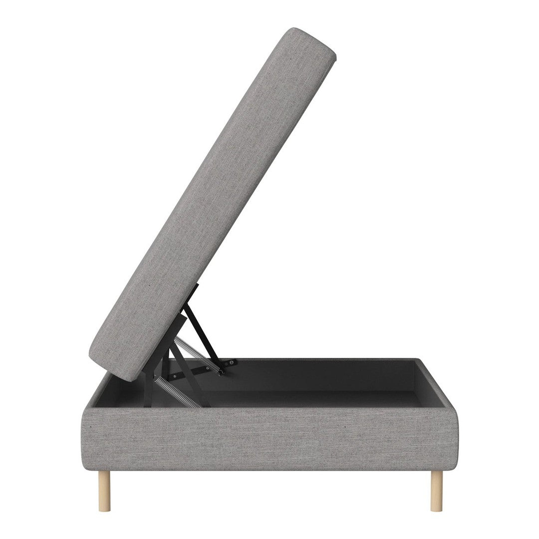 Gray upholstered storage bed with a sleek design and natural wood legs, showcasing a minimalist modern aesthetic.