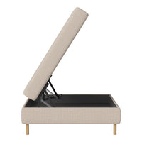 Beige upholstered storage bed with a sleek, modern design and natural wood legs, featuring a simple, textured pattern.