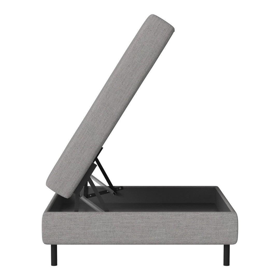 Grey upholstered storage bed with minimalistic design and sleek black base. Ideal for modern and stylish interiors.