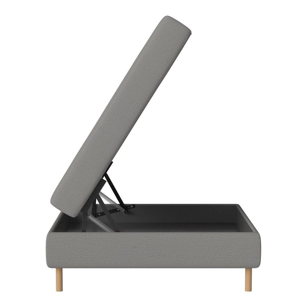 Grey upholstered storage bench with a sleek, minimalist design and natural wood legs. Ideal for modern decor.