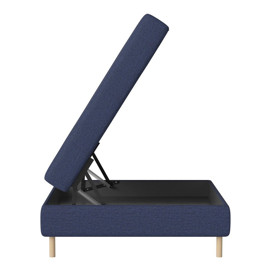 Navy blue upholstered storage bed with a textured pattern and light wooden legs, partially lifted to reveal storage space.